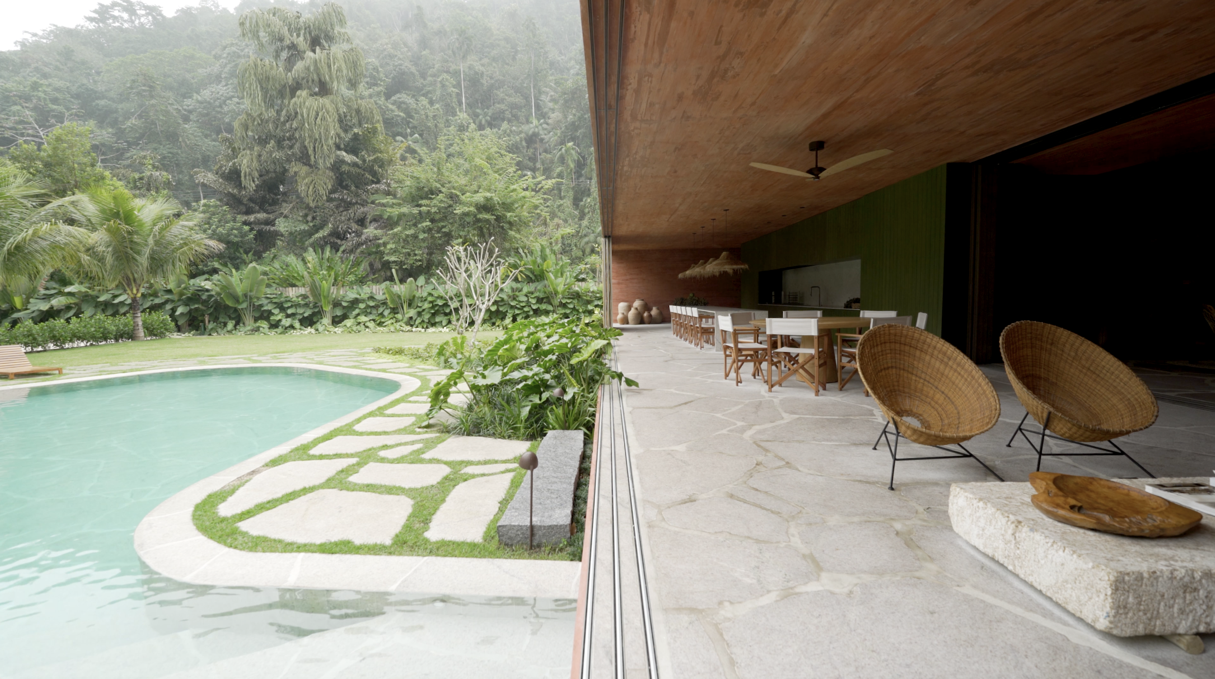 Laranjeiras house blends seamlessly with nature, using sustainable design and natural materials to harmonize with its surroundings.