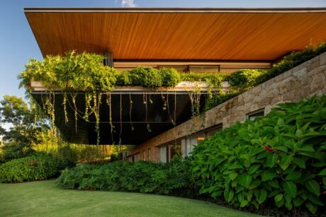 Explore RDJ House by Jacobsen Arquitetura, nestled in a forest reserve. Discover this stunning design that connects indoor living with nature.
